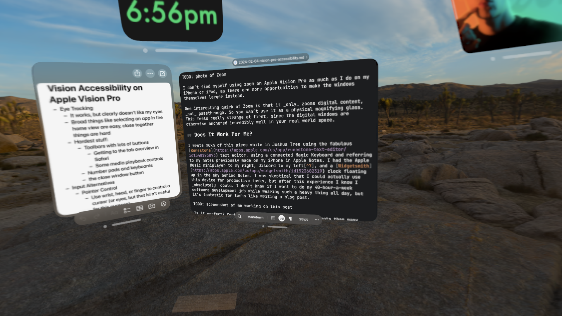 Screenshot of windows in visionOS in the Joshua Tree environment. Notes appears on the left with bullets relating to this article. A clock widget shows above it reading 6:56pm. To the right of Notes is a text editor window with a rough draft of this piece. Below is is a hint of passthrough showing a Magic Keyboard. In the top right, the Apple Music miniplayer can be partially seen with the album art for Neil Cicierega's Mouth Moods displayed.